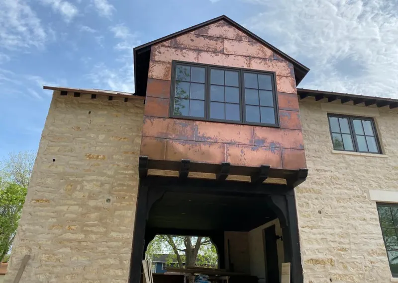 Copper metal panel facade on a stone building for Roof Repair in Twinsburg